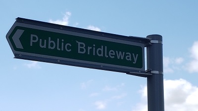 SIgn at western end pointing along path